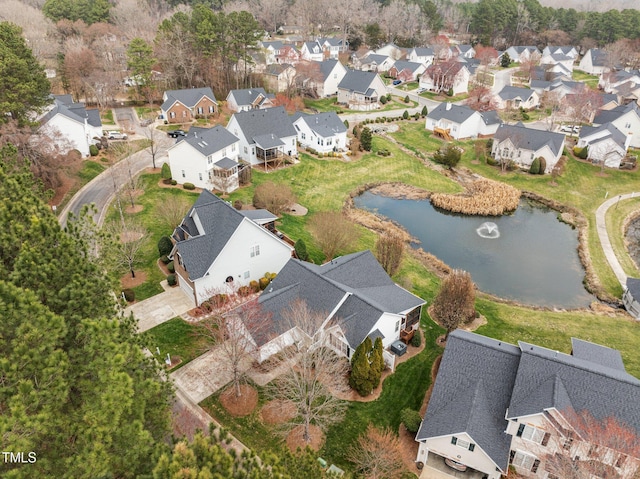 bird's eye view featuring a residential view and a water view