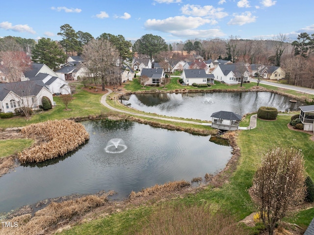 birds eye view of property with a residential view and a water view