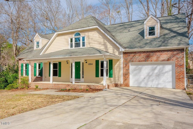 view of front facade featuring a porch, an attached garage, brick siding, a shingled roof, and driveway