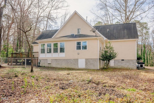 view of property exterior featuring crawl space and a deck