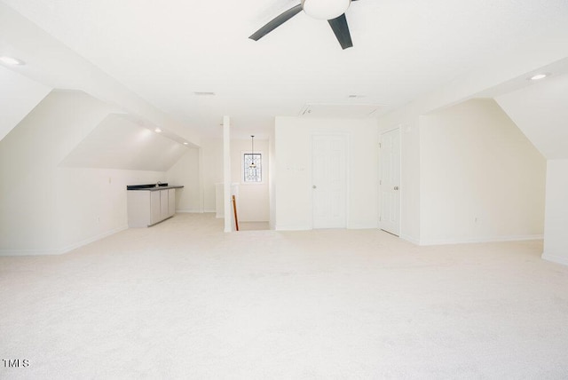 bonus room with lofted ceiling, light colored carpet, and ceiling fan