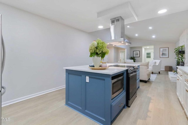 kitchen featuring open floor plan, blue cabinets, island exhaust hood, light wood-style floors, and range with electric stovetop