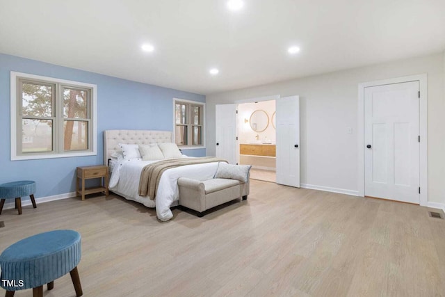 bedroom with connected bathroom, light wood-style flooring, recessed lighting, visible vents, and baseboards