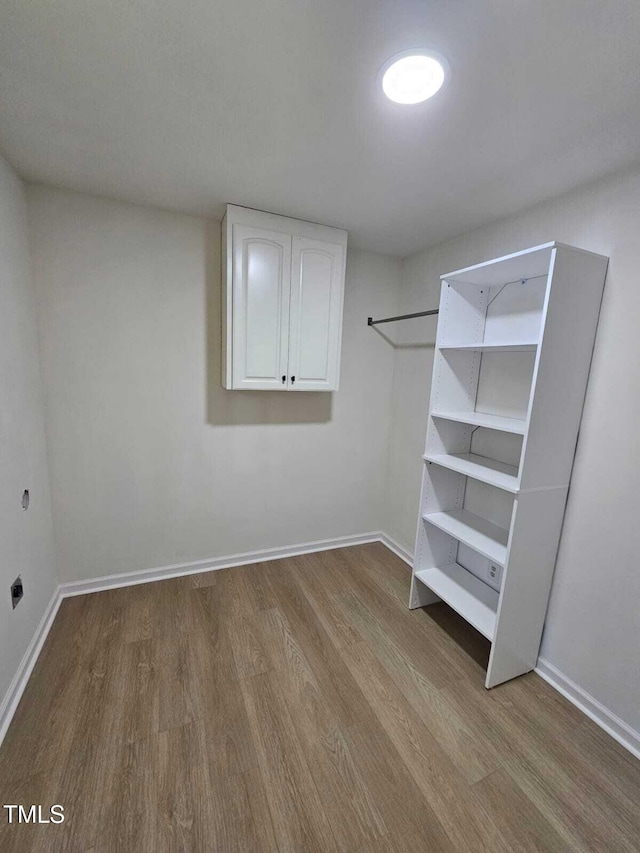 spacious closet featuring wood finished floors