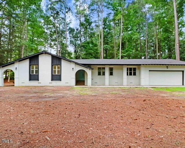 view of front facade with a garage and crawl space