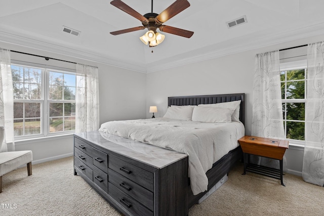 bedroom featuring light carpet, multiple windows, and visible vents