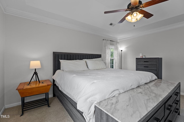 bedroom featuring baseboards, visible vents, ornamental molding, and light colored carpet