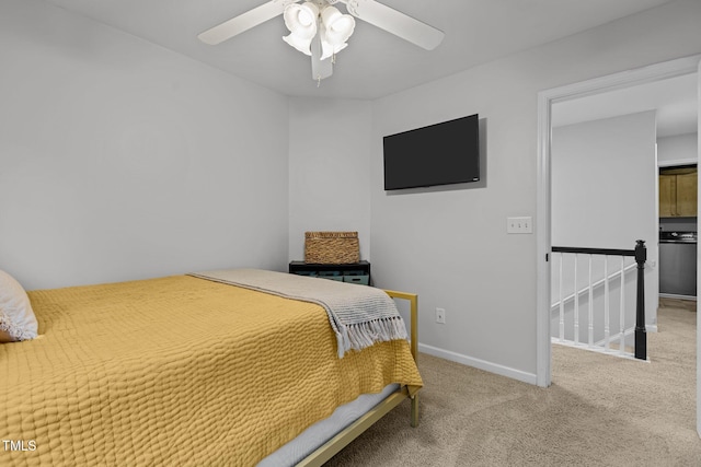 carpeted bedroom featuring ceiling fan and baseboards