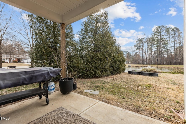 view of patio / terrace with a water view