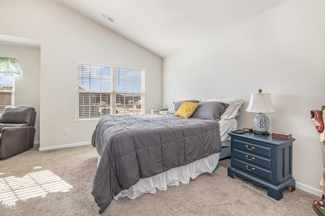 bedroom featuring light carpet, baseboards, visible vents, and vaulted ceiling