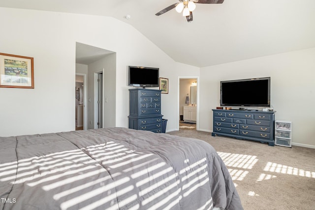 bedroom with light colored carpet, a ceiling fan, ensuite bath, high vaulted ceiling, and baseboards