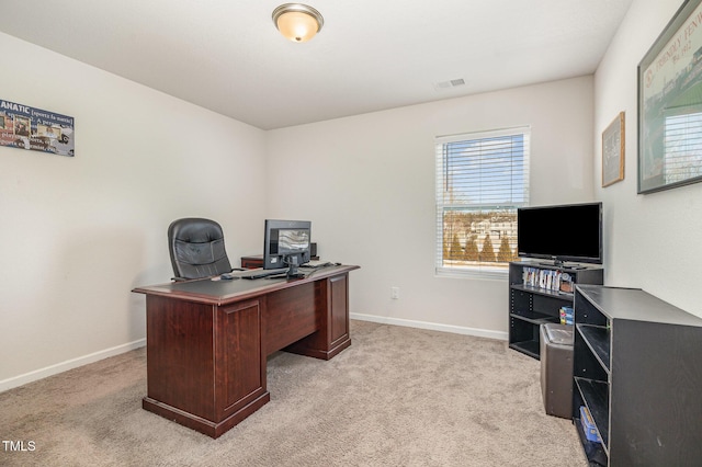 office featuring light carpet, visible vents, and baseboards