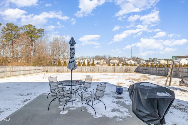 view of patio / terrace with outdoor dining area, a fenced backyard, and area for grilling