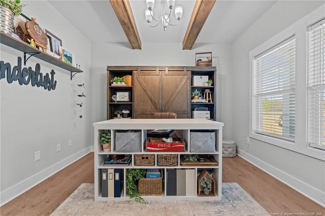 office space featuring wood finished floors, beam ceiling, and baseboards