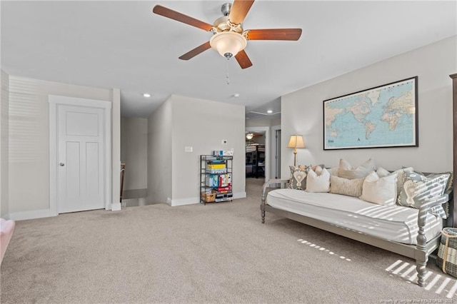 living room with recessed lighting, baseboards, a ceiling fan, and light colored carpet