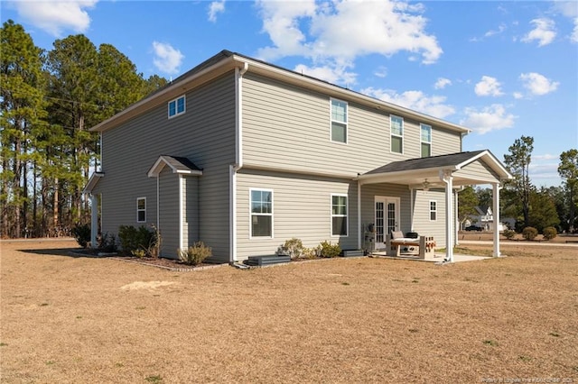 back of property with a patio