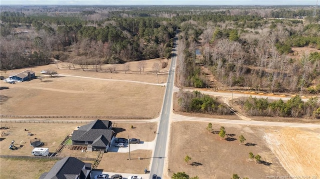 bird's eye view with a rural view and a view of trees