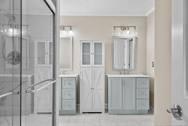 bathroom featuring marble finish floor, two vanities, a sink, and a marble finish shower