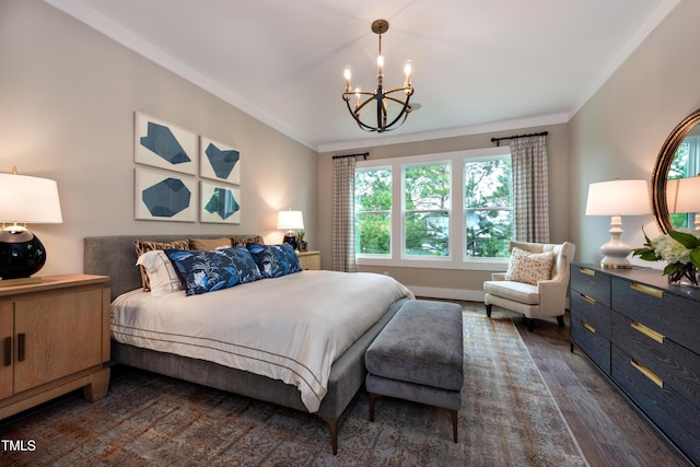 bedroom featuring crown molding, dark wood-type flooring, and a notable chandelier