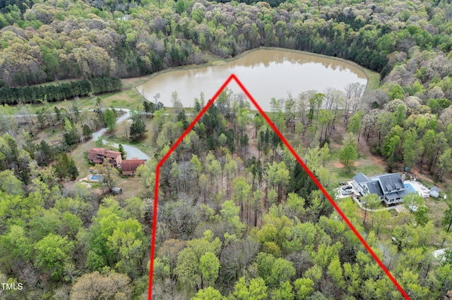 birds eye view of property with a water view and a forest view