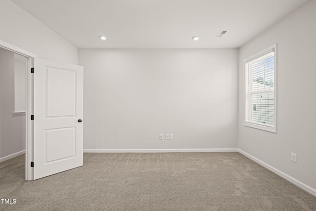 spare room with visible vents, baseboards, carpet flooring, and recessed lighting