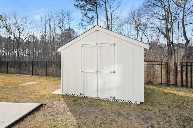 view of shed with a fenced backyard