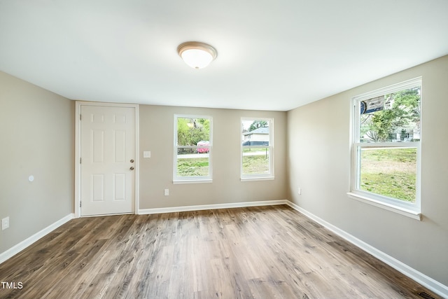 501 N 14th St, Erwin, NC 28339 - unfurnished room featuring visible vents, wood finished floors, and baseboards