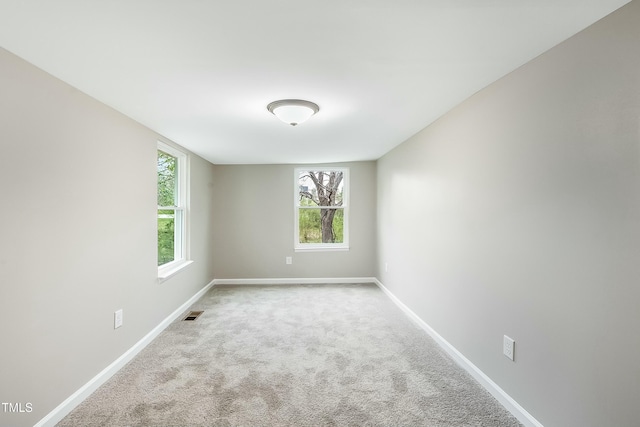 501 N 14th St, Erwin, NC 28339 - empty room featuring visible vents, baseboards, and carpet floors