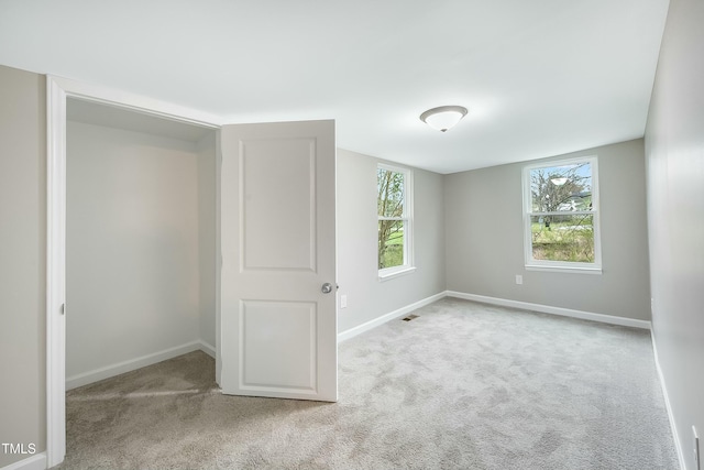 501 N 14th St, Erwin, NC 28339 - carpeted spare room with visible vents and baseboards