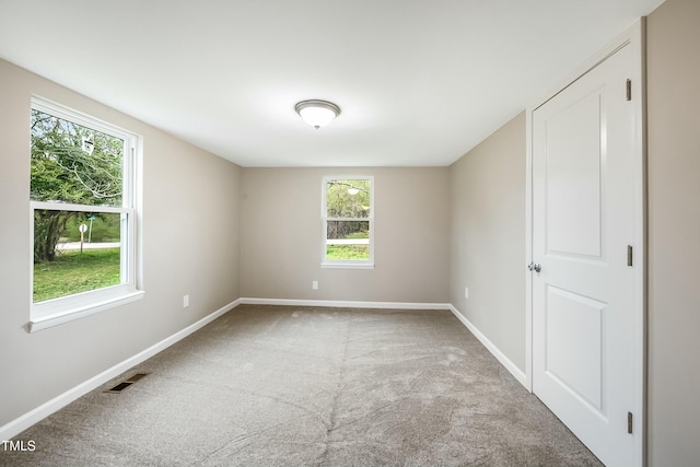 501 N 14th St, Erwin, NC 28339 - carpeted empty room featuring visible vents and baseboards