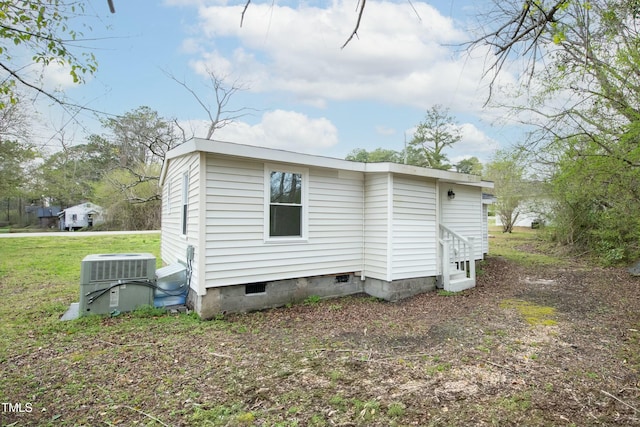 501 N 14th St, Erwin, NC 28339 - exterior space with crawl space, central air condition unit, and a front lawn