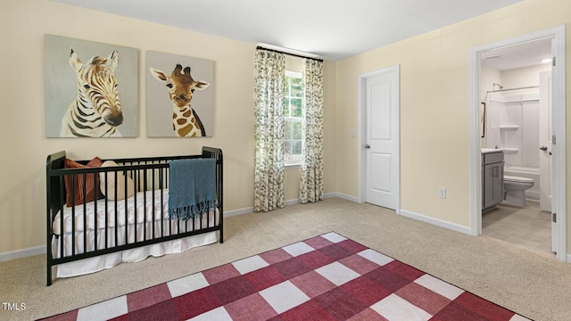 bedroom featuring carpet flooring, connected bathroom, and baseboards