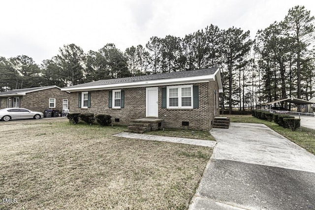 view of front facade with crawl space, a front yard, and brick siding