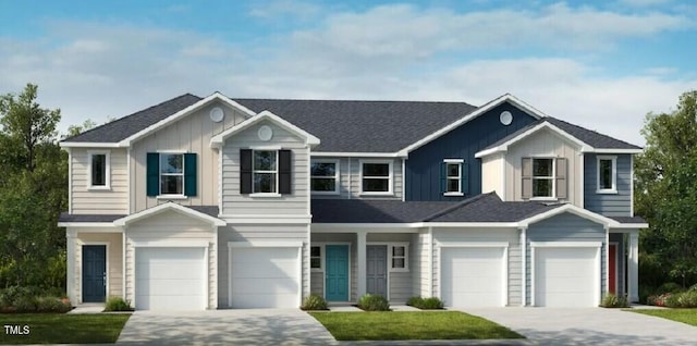 view of front of property featuring board and batten siding, driveway, and an attached garage