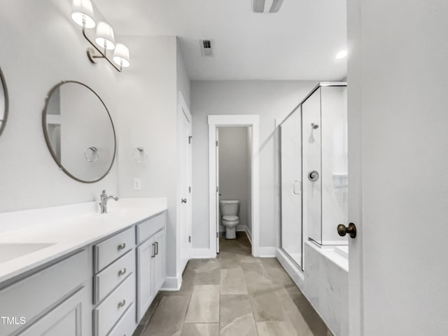 full bathroom featuring toilet, a stall shower, a sink, and visible vents