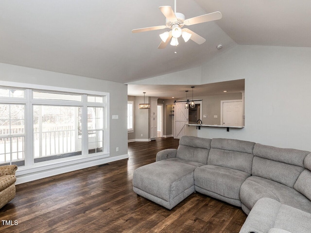 living room with visible vents, baseboards, lofted ceiling, dark wood-style floors, and ceiling fan