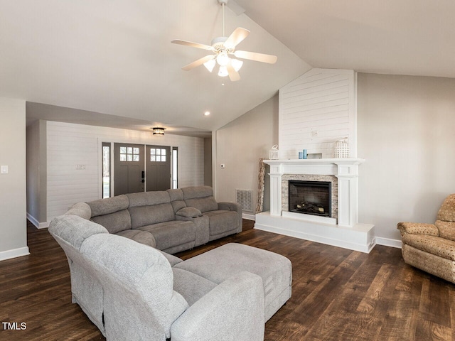 living room featuring vaulted ceiling, dark wood-type flooring, visible vents, and baseboards