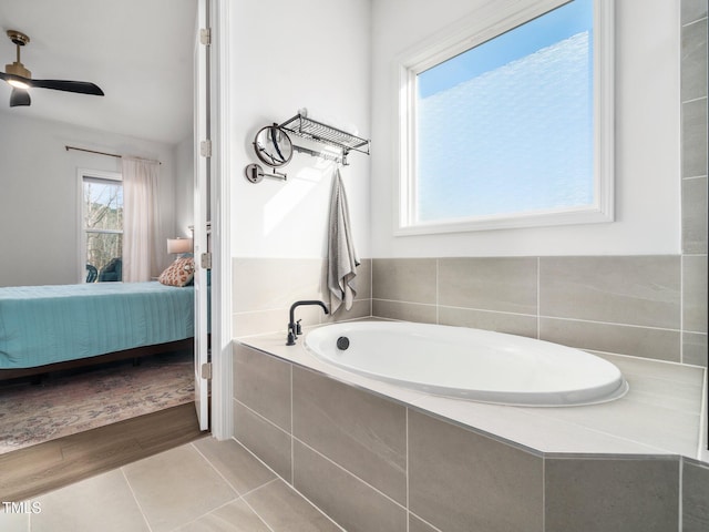 ensuite bathroom with tile patterned flooring, ensuite bath, and a bath