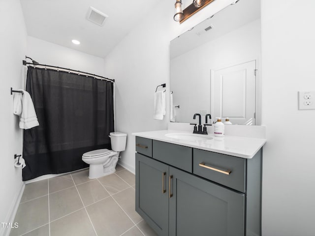 bathroom featuring tile patterned flooring, visible vents, vanity, and toilet