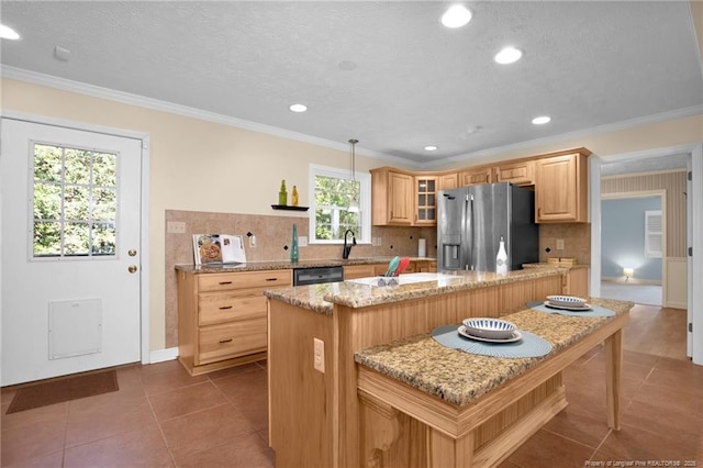 kitchen featuring black dishwasher, stainless steel fridge, decorative backsplash, crown molding, and dark tile patterned floors