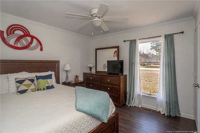 bedroom featuring multiple windows, visible vents, dark wood-type flooring, and crown molding