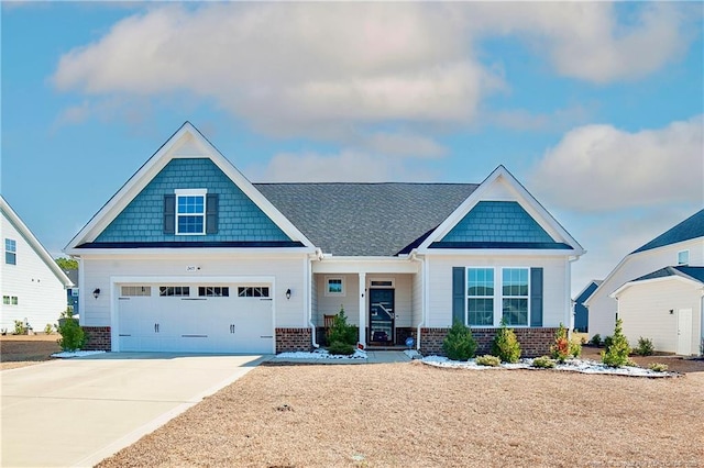 craftsman inspired home featuring a garage, brick siding, and driveway