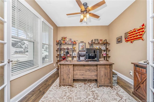 office featuring ceiling fan, baseboards, and wood finished floors