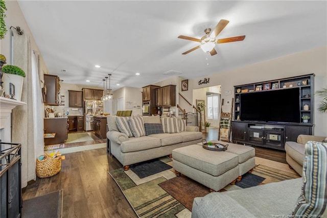 living room with visible vents, a ceiling fan, wood finished floors, a fireplace, and recessed lighting