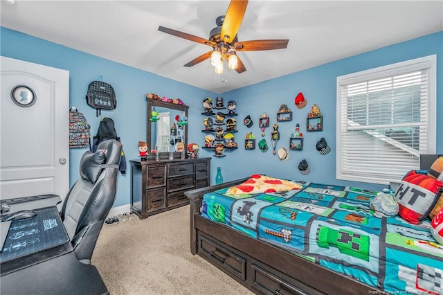 carpeted bedroom featuring ceiling fan and baseboards