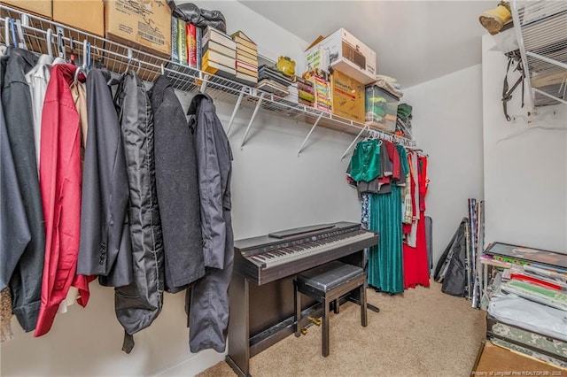 walk in closet featuring carpet