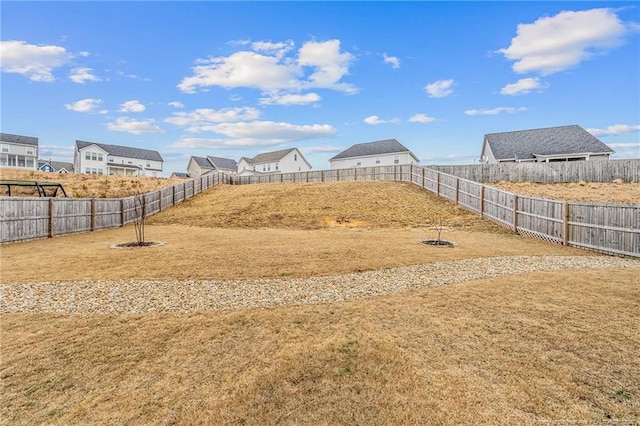 view of yard with a fenced backyard