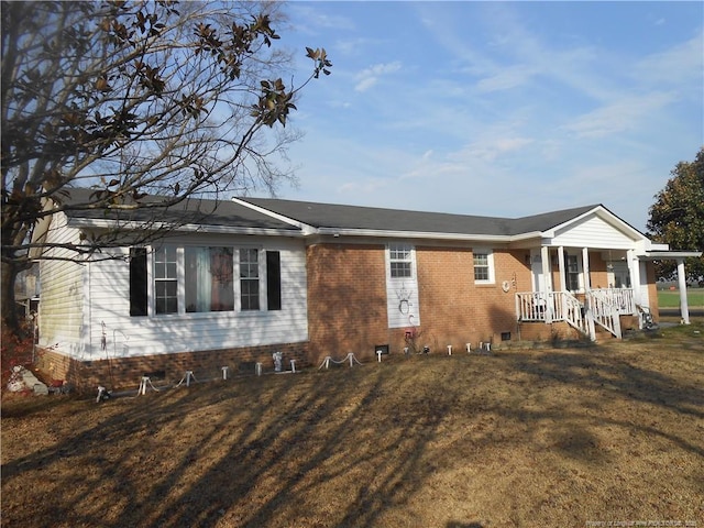 single story home featuring a front lawn, crawl space, and brick siding