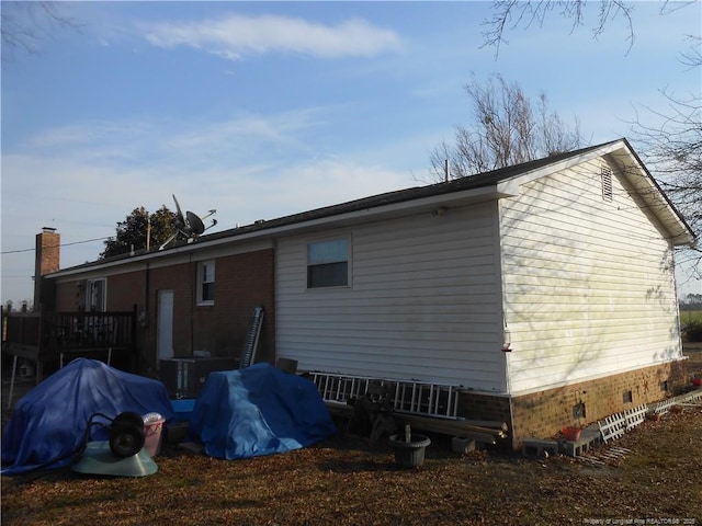 rear view of house with crawl space