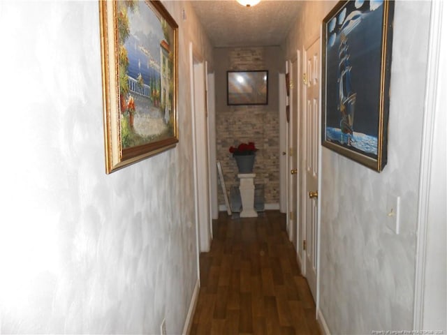 corridor featuring wood finished floors